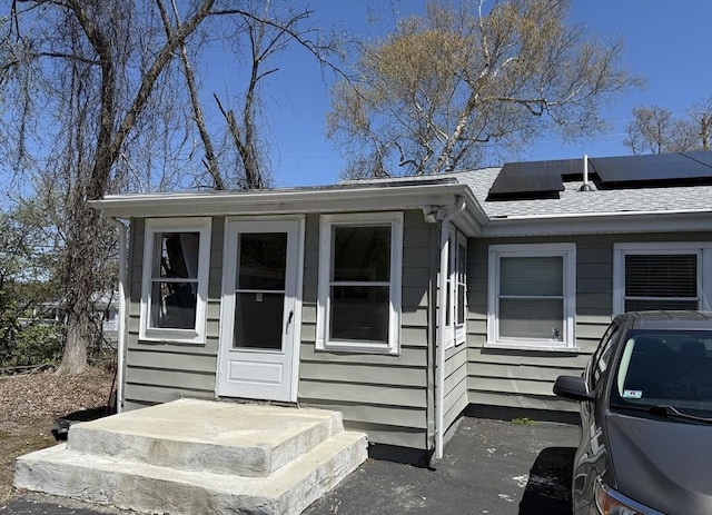 626 Nashua Rd, Dracut, MA 01826 - view of front of home featuring solar panels and a shingled roof
