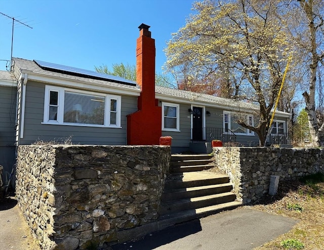 626 Nashua Rd, Dracut, MA 01826 - ranch-style home with a chimney and solar panels