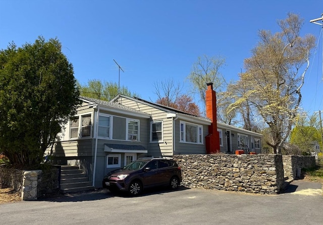 626 Nashua Rd, Dracut, MA 01826 - view of front facade with a chimney and stairs