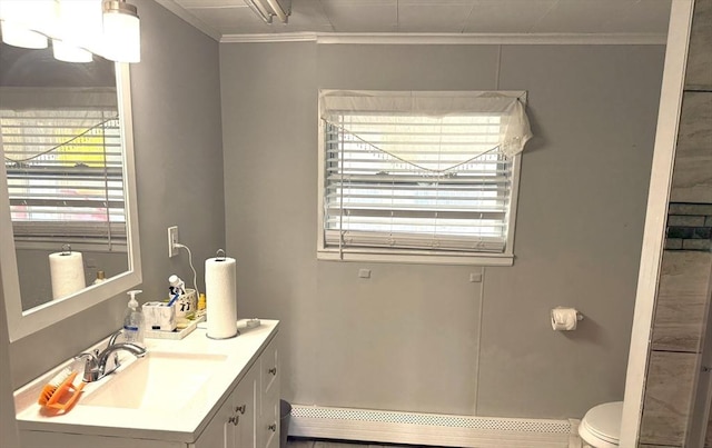 626 Nashua Rd, Dracut, MA 01826 - bathroom with crown molding, toilet, baseboard heating, and vanity