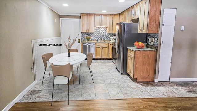 kitchen with stainless steel appliances, backsplash, baseboards, and light stone countertops