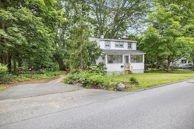 486 Franklin St, Reading, MA 01867 - view of front of property featuring a front lawn