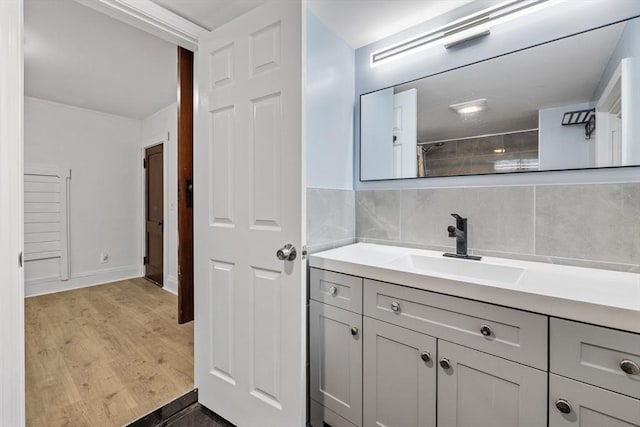 486 Franklin St, Reading, MA 01867 - full bath featuring vanity, backsplash, a shower with curtain, and wood finished floors