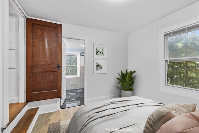 486 Franklin St, Reading, MA 01867 - bedroom with wood finished floors, crown molding, and ensuite bath