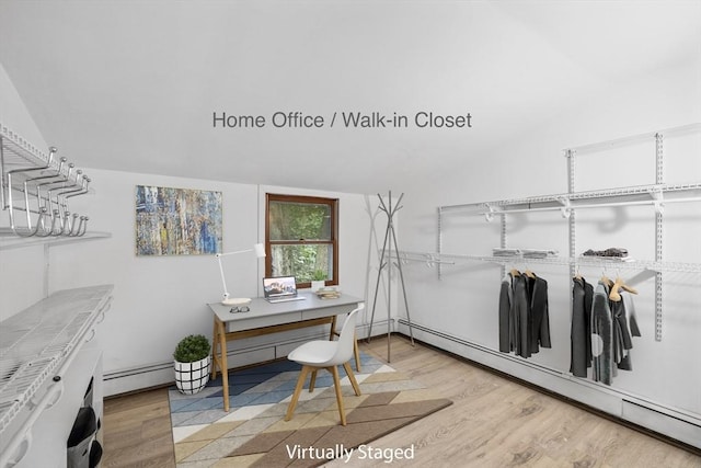 486 Franklin St, Reading, MA 01867 - office area featuring baseboard heating, light wood-type flooring, and vaulted ceiling