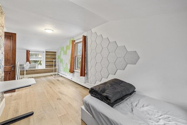 486 Franklin St, Reading, MA 01867 - living area featuring hardwood / wood-style floors, lofted ceiling, and baseboard heating
