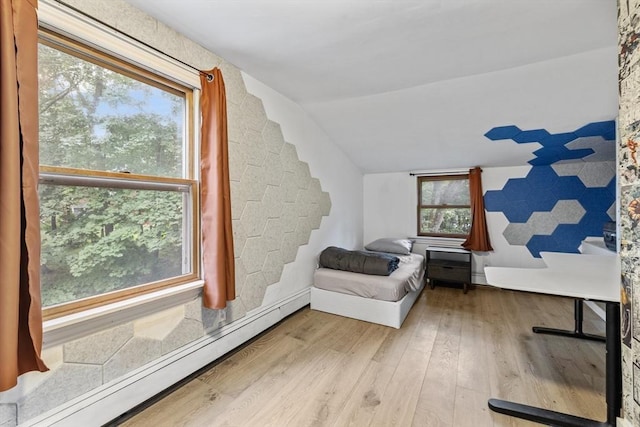 486 Franklin St, Reading, MA 01867 - living area featuring baseboard heating, lofted ceiling, and wood finished floors