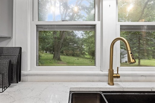 486 Franklin St, Reading, MA 01867 - kitchen view of a sink and light stone countertops