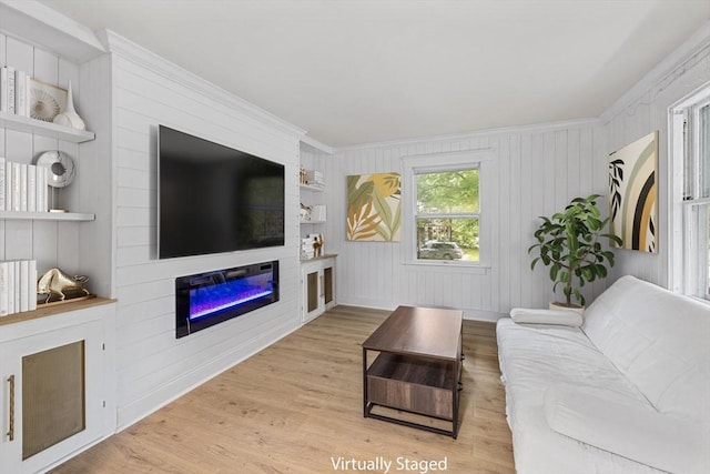486 Franklin St, Reading, MA 01867 - living room featuring wood finished floors, a large fireplace, built in features, ornamental molding, and wooden walls