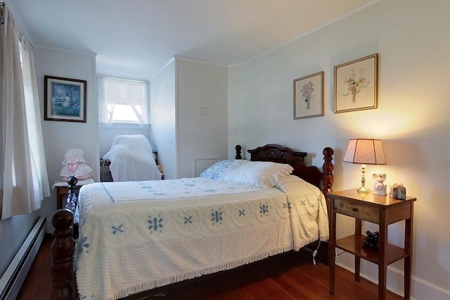 bedroom with a baseboard radiator, dark wood finished floors, and crown molding