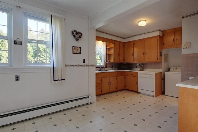 kitchen featuring a baseboard radiator, a sink, dishwasher, light floors, and washer / clothes dryer