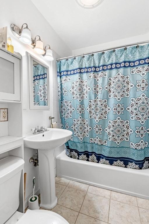 71 Ocean Ave Unit 3, Salem, MA 01970 - full bath with shower / tub combo with curtain, tile patterned flooring, and lofted ceiling