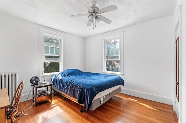 71 Ocean Ave Unit 3, Salem, MA 01970 - bedroom featuring wood finished floors, radiator heating unit, and ceiling fan
