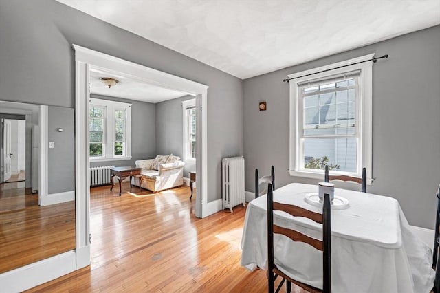71 Ocean Ave Unit 3, Salem, MA 01970 - dining room with radiator heating unit and light wood-style flooring