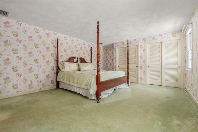 12 Checkerberry Cir, Sudbury, MA 01776 - carpeted bedroom with wallpapered walls and multiple closets