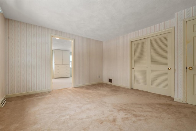 12 Checkerberry Cir, Sudbury, MA 01776 - unfurnished bedroom featuring wallpapered walls and carpet flooring