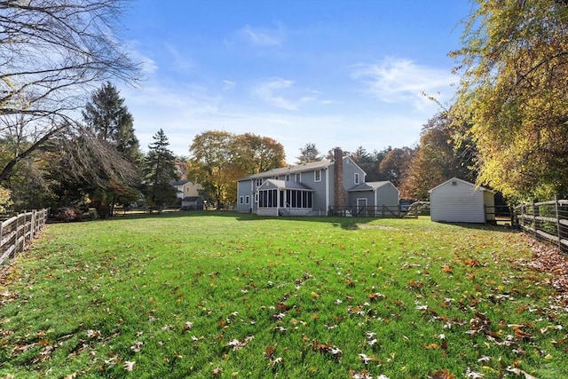 12 Checkerberry Cir, Sudbury, MA 01776 - fenced backyard featuring a sunroom and a shed