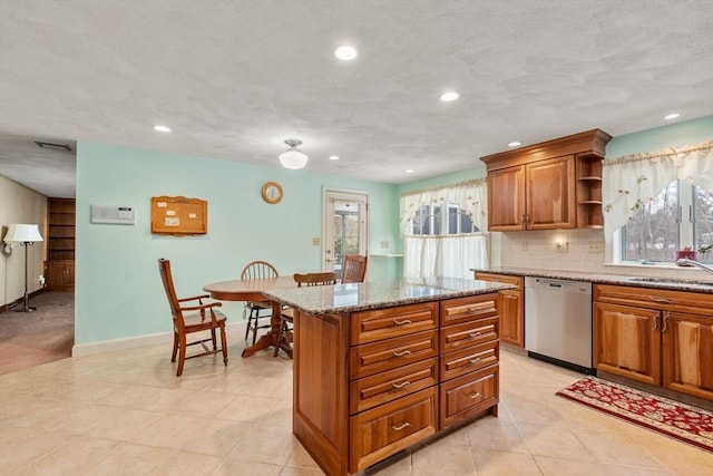 12 Checkerberry Cir, Sudbury, MA 01776 - kitchen with dishwasher, brown cabinetry, a kitchen island, open shelves, and recessed lighting