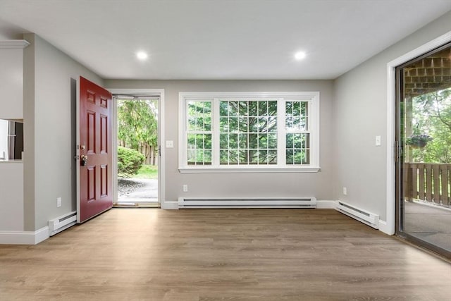 1029 Iyannough Rd Unit 9B, Barnstable, MA 02601 - foyer entrance with baseboard heating, wood finished floors, recessed lighting, and baseboards