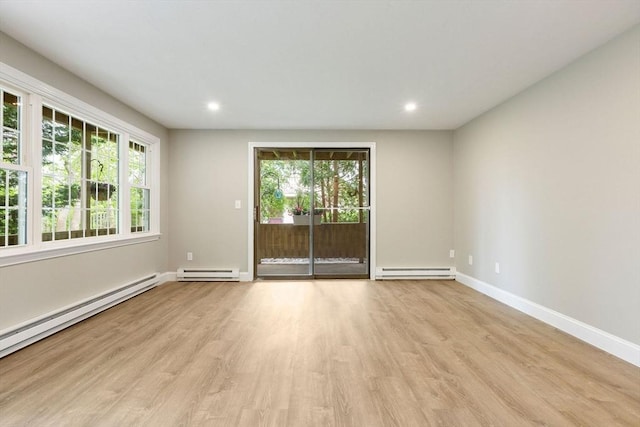 1029 Iyannough Rd Unit 9B, Barnstable, MA 02601 - spare room featuring a baseboard heating unit, a baseboard radiator, plenty of natural light, light wood-style floors, and recessed lighting