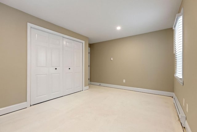 1029 Iyannough Rd Unit 9B, Barnstable, MA 02601 - unfurnished bedroom with a baseboard radiator, baseboards, recessed lighting, and a closet