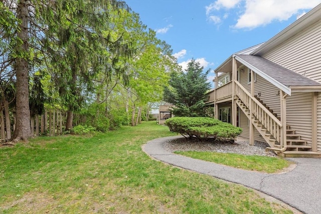 1029 Iyannough Rd Unit 9B, Barnstable, MA 02601 - view of grassy yard featuring stairway and a wooden deck