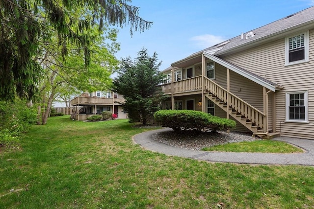 1029 Iyannough Rd Unit 9B, Barnstable, MA 02601 - view of grassy yard with stairway and a deck