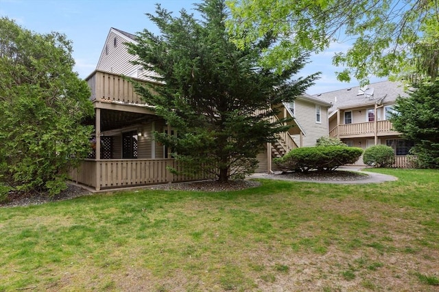 1029 Iyannough Rd Unit 9B, Barnstable, MA 02601 - view of grassy yard featuring stairway