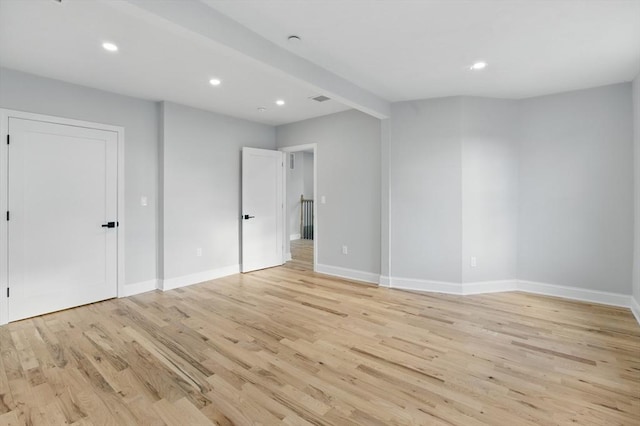 unfurnished bedroom featuring light wood-style floors, baseboards, and recessed lighting