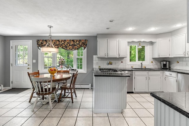 5 Hansen Ave, Burlington, MA 01803 - kitchen with a sink, healthy amount of natural light, stainless steel appliances, decorative backsplash, and recessed lighting
