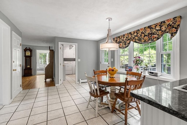 5 Hansen Ave, Burlington, MA 01803 - dining room featuring separate washer and dryer, light tile patterned flooring, and baseboard heating