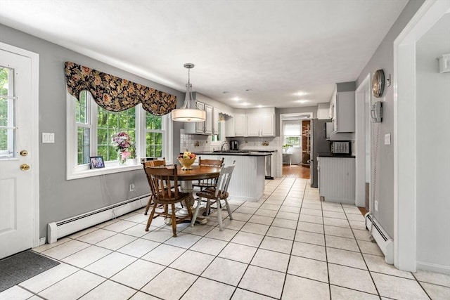 5 Hansen Ave, Burlington, MA 01803 - dining space featuring baseboard heating and light tile patterned floors