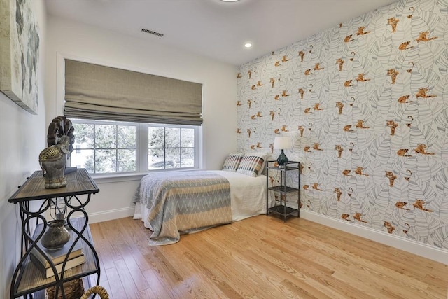 bedroom with recessed lighting, visible vents, baseboards, and light wood-style flooring