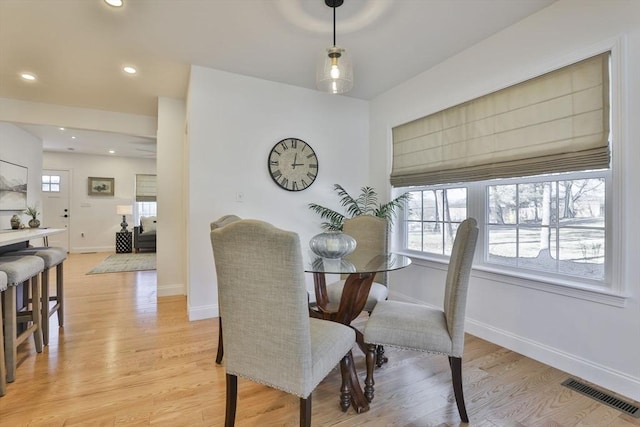 dining area with light wood-type flooring, visible vents, baseboards, and recessed lighting