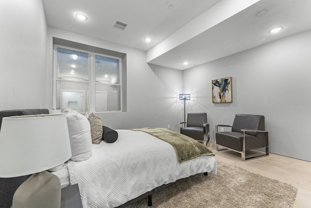 bedroom with light hardwood / wood-style floors