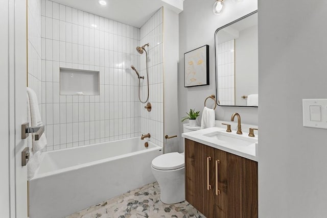 full bathroom with tile patterned floors, vanity, toilet, and tiled shower / bath