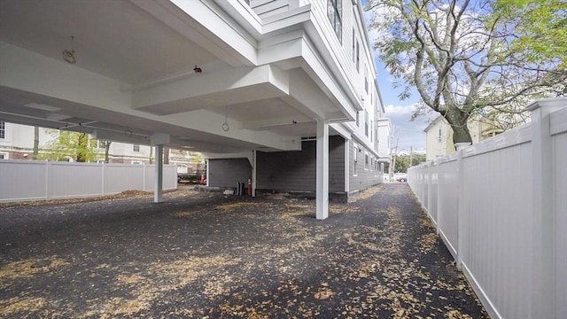 view of side of home with a carport