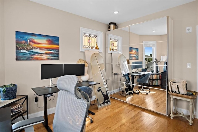 office space with hardwood / wood-style floors