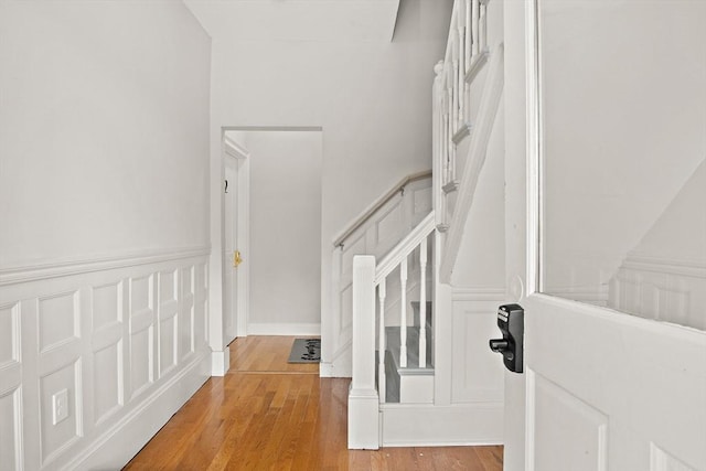 stairs featuring wood-type flooring