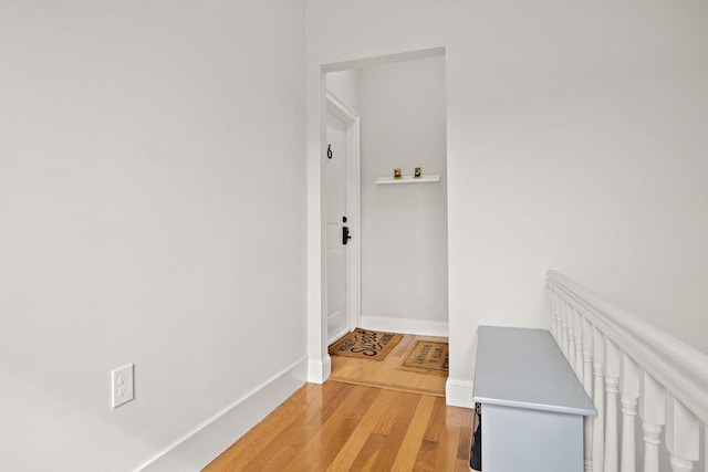 hallway featuring hardwood / wood-style flooring