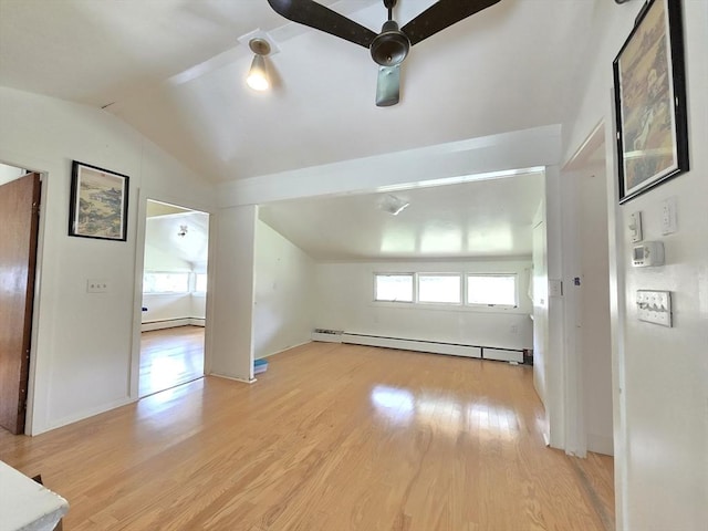 bonus room with ceiling fan, vaulted ceiling, light wood-style floors, and a baseboard radiator