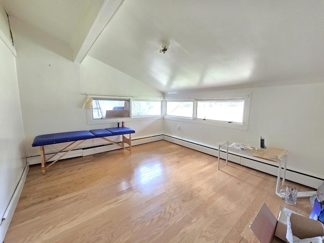 unfurnished room with baseboard heating, baseboards, vaulted ceiling with beams, and wood finished floors