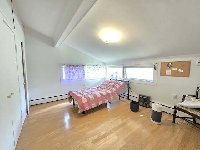 bedroom featuring lofted ceiling with beams, a baseboard heating unit, and wood finished floors