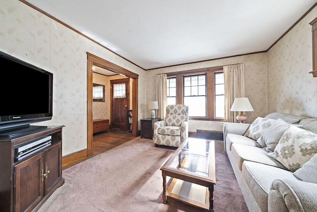 carpeted living room with crown molding, wallpapered walls, and baseboards
