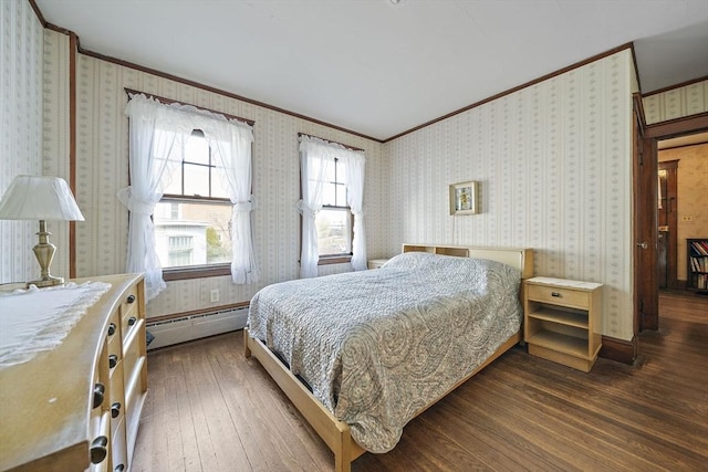 bedroom with dark wood finished floors, crown molding, and a baseboard radiator