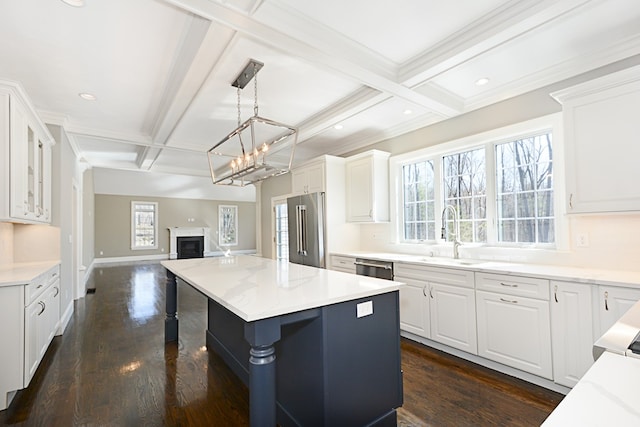 kitchen featuring white cabinets, stainless steel appliances, coffered ceiling, and dark hardwood / wood-style floors