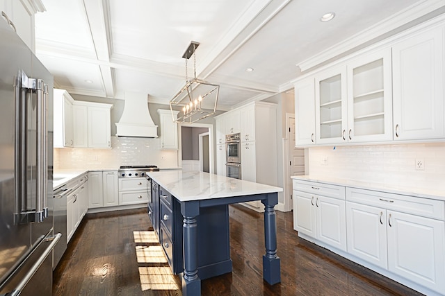 kitchen with dark hardwood / wood-style floors, white cabinets, custom range hood, a center island, and stainless steel appliances