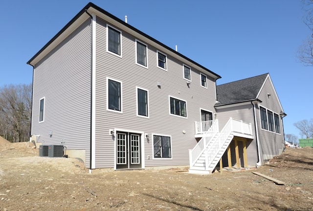 back of house featuring cooling unit