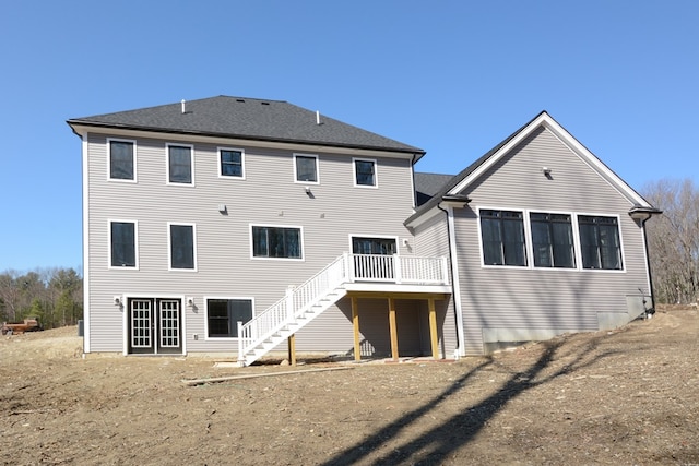 back of house with a wooden deck