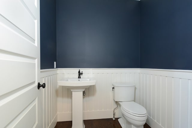 bathroom featuring sink, toilet, and hardwood / wood-style floors